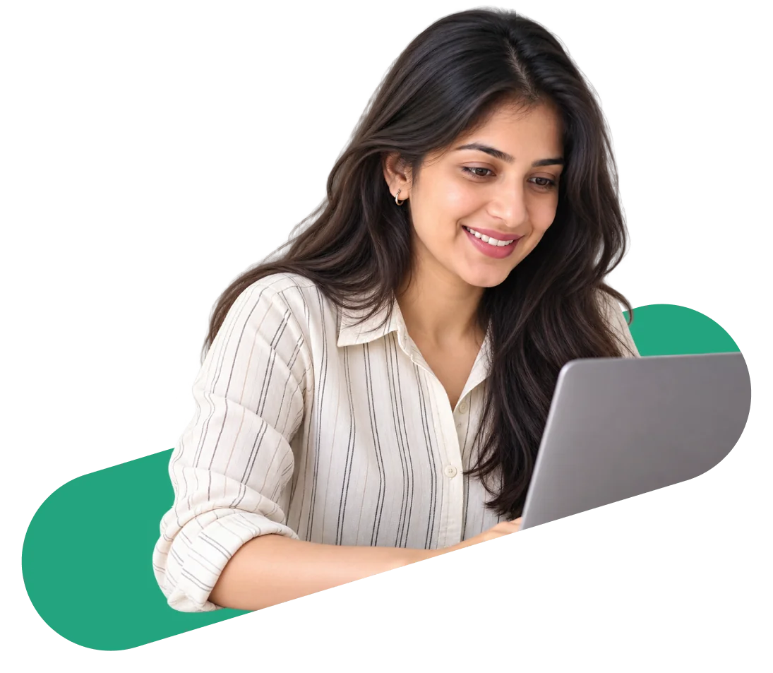 A candidate smiling while working on a laptop
